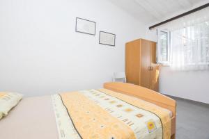 Postel nebo postele na pokoji v ubytování Apartments Mira