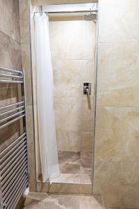 Koupelna v ubytování Hotel Garni