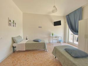 Postel nebo postele na pokoji v ubytování Guest House Service - Modugno