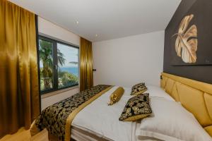 Posteľ alebo postele v izbe v ubytovaní Villa Bloomhill Escape
