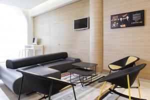 TV a/nebo společenská místnost v ubytování Novotel Brussels Centre Midi