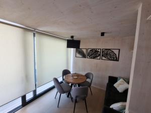 a room with a table and chairs and a window at Arcadia - Beach villa n.1 in Privlaka