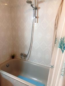 a bath tub in a bathroom with a shower at Casa a Gallipoli a 1 minuto dal mare in Gallipoli