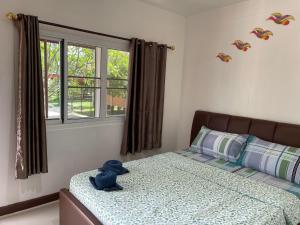 Postel nebo postele na pokoji v ubytování Kalae Resort