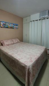 Cama ou camas em um quarto em Estúdio aconchegante em Itapuã a 5 min. da praia