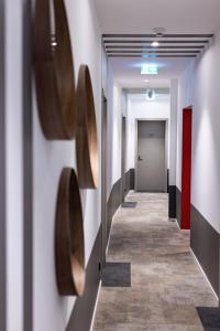 a corridor of a hallway with a hallway at BC Hotel Bad Kreuznach mit Restaurant Mühlentor in Bad Kreuznach +45 photos