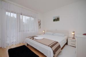 Ένα ή περισσότερα κρεβάτια σε δωμάτιο στο Apartment Marija