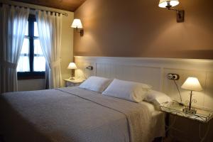 A bed or beds in a room at Casa Puertas Még 37 kép