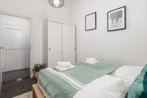 Posteľ alebo postele v izbe v ubytovaní Apartman LaMandra