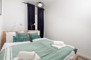 Posteľ alebo postele v izbe v ubytovaní Apartman LaMandra
