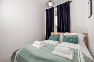 Posteľ alebo postele v izbe v ubytovaní Apartman LaMandra