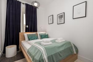 Posteľ alebo postele v izbe v ubytovaní Apartman LaMandra
