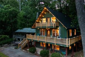 a green house with a black roof at Chimney Rock Chalet Near Lake Lure! in Chimney Rock