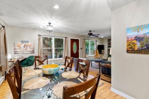 a dining room with a table and chairs at Chimney Rock Chalet Near Lake Lure! in Chimney Rock