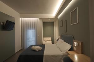 a bedroom with a bed with two towels on it at ELISEO PALACE TROPEA in Tropea