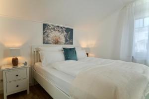 Postelja oz. postelje v sobi nastanitve MyHome Ruegen - Haus Sonnenmeer