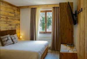 Postel nebo postele na pokoji v ubytování Hotel Da Franco e Adriana