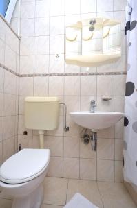 Ванная комната в Apartments and Rooms Mare