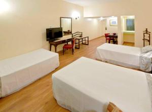 Dayrell Hotel e Centro de Convenções客房内的一张或多张床位