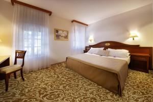 Postel nebo postele na pokoji v ubytování Hotel Convent - Hotel & Resort Adria Ankaran