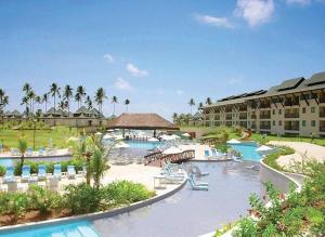 a resort with a swimming pool and a resort at Flat no Beach Class Resort in Porto De Galinhas