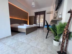 Posteľ alebo postele v izbe v ubytovaní Amarylis Beachfront Studios