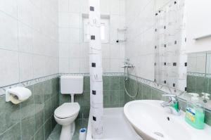 Kúpeľňa v ubytovaní Apartments and Room Ljubica