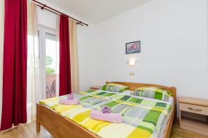 Posteľ alebo postele v izbe v ubytovaní Apartments and Room Ljubica