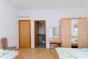 Posteľ alebo postele v izbe v ubytovaní Apartments and Room Ljubica