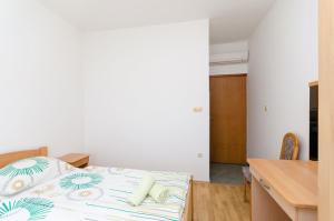 Posteľ alebo postele v izbe v ubytovaní Apartments and Room Ljubica