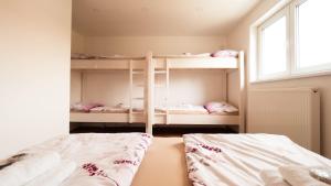Posteľ alebo postele v izbe v ubytovaní Apartmány Habánská, celý dům