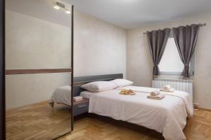 Postel nebo postele na pokoji v ubytování Luxury apartments CasaBlanca/Vivaldi