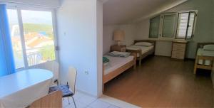 Postel nebo postele na pokoji v ubytování Apartments Ćenan