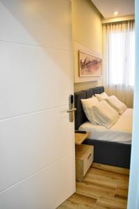 Postel nebo postele na pokoji v ubytování DelMar Apartments