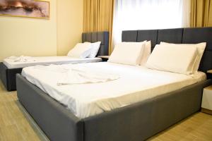 Voodi või voodid majutusasutuse HotelApart - DelMar toas