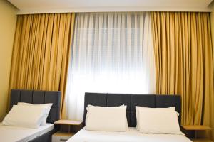 Voodi või voodid majutusasutuse HotelApart - DelMar toas