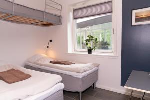 Postel nebo postele na pokoji v ubytování ICV SleepWell