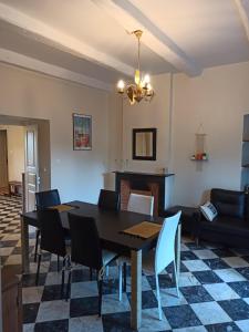a dining room with a table and chairs at Chez Laurette Murato in Murato