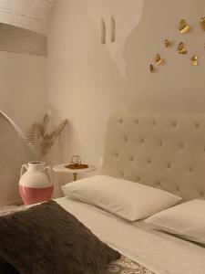 Postel nebo postele na pokoji v ubytování Nenetta Rooms & Suites Monopoli