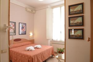 Postel nebo postele na pokoji v ubytování Hotel Massimo
