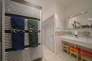 a bathroom with a sink and a mirror at "La Locanda" Campione del Garda in Campione del Garda