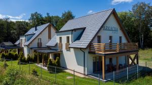 a rendering of a house with metal roof at Villa Arkadia PORTUS in Dziwnów