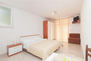 Postel nebo postele na pokoji v ubytování Apartments Ante