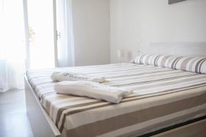 A bed or beds in a room at BluRiva Hotel