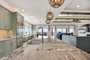 a kitchen with a large marble counter top at Saltwater Gospel in Oak Island