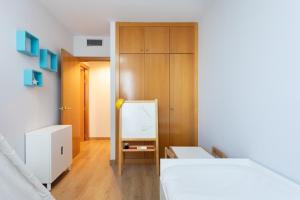 Posteľ alebo postele v izbe v ubytovaní Home2Book Executive & Design Las Torres