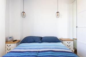 Posteľ alebo postele v izbe v ubytovaní Home2Book Executive & Design Las Torres