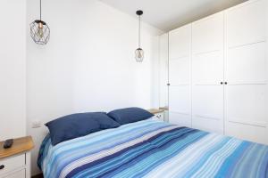 Posteľ alebo postele v izbe v ubytovaní Home2Book Executive & Design Las Torres