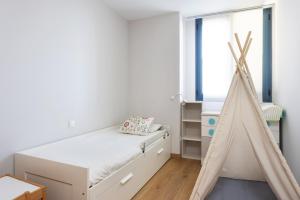 Posteľ alebo postele v izbe v ubytovaní Home2Book Executive & Design Las Torres