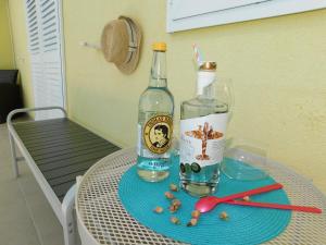 a bottle of wine and a glass on a table at Apartment Dalmatia Ketty in Makarska